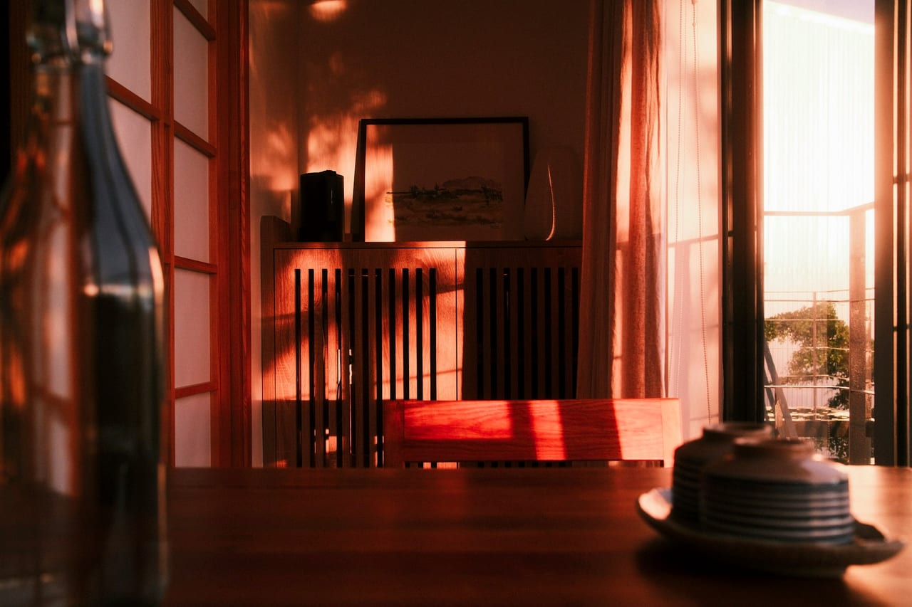 A café dining room in warm golden-hour light.
