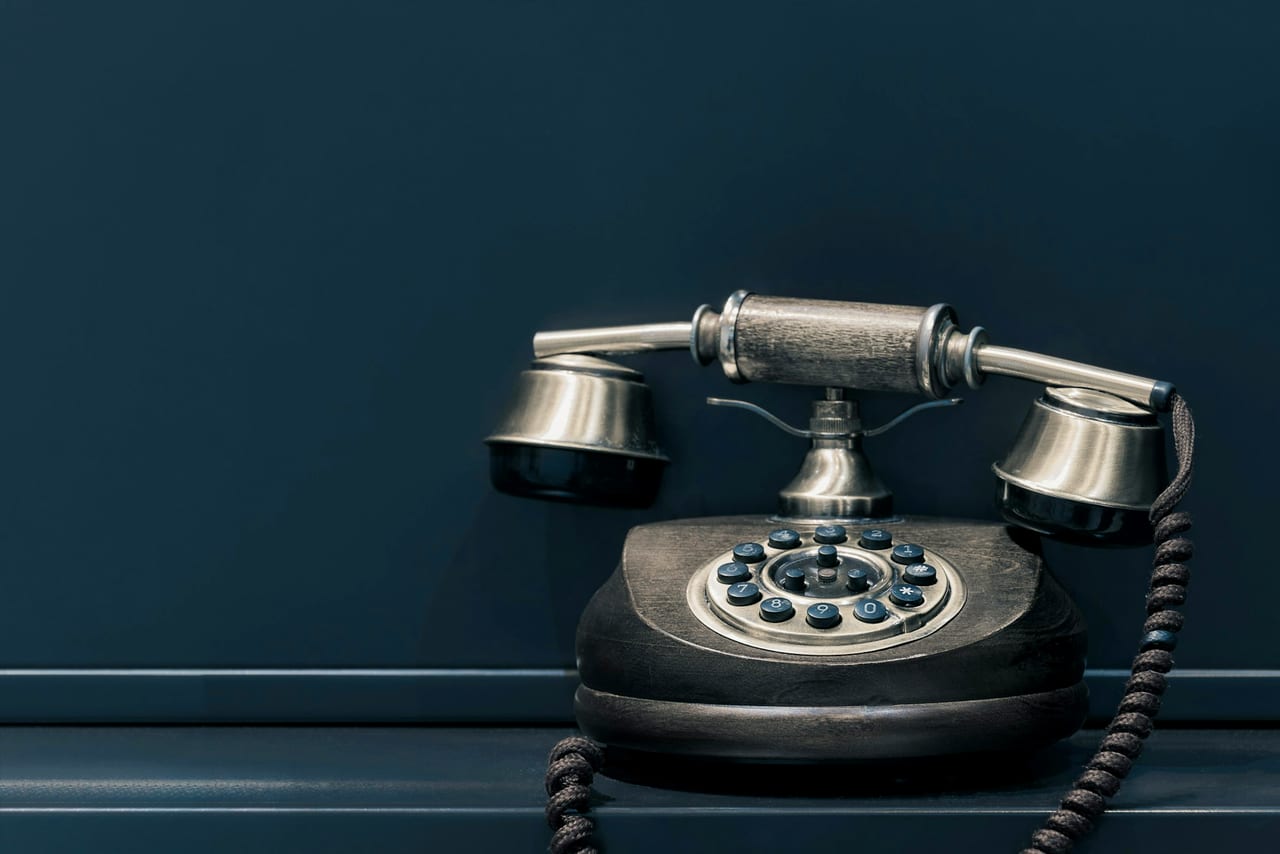 A telephone handset waiting to be answered.