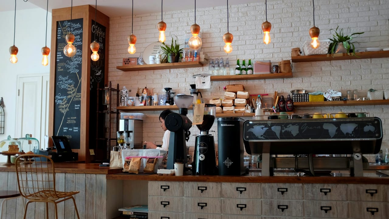 A Sydney café in the morning, warm light through the windows, ready for service.