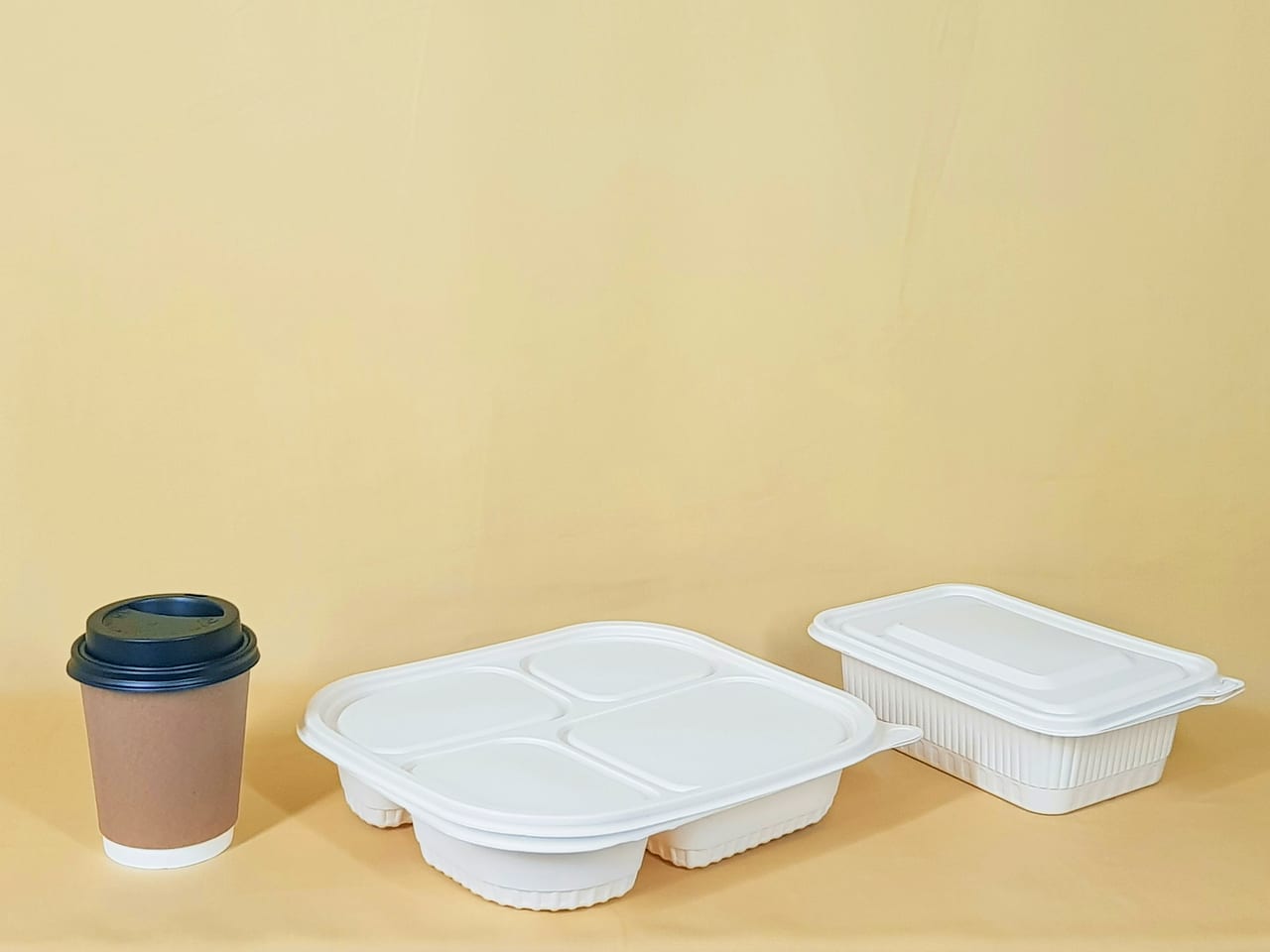 A takeaway container on a wooden table.