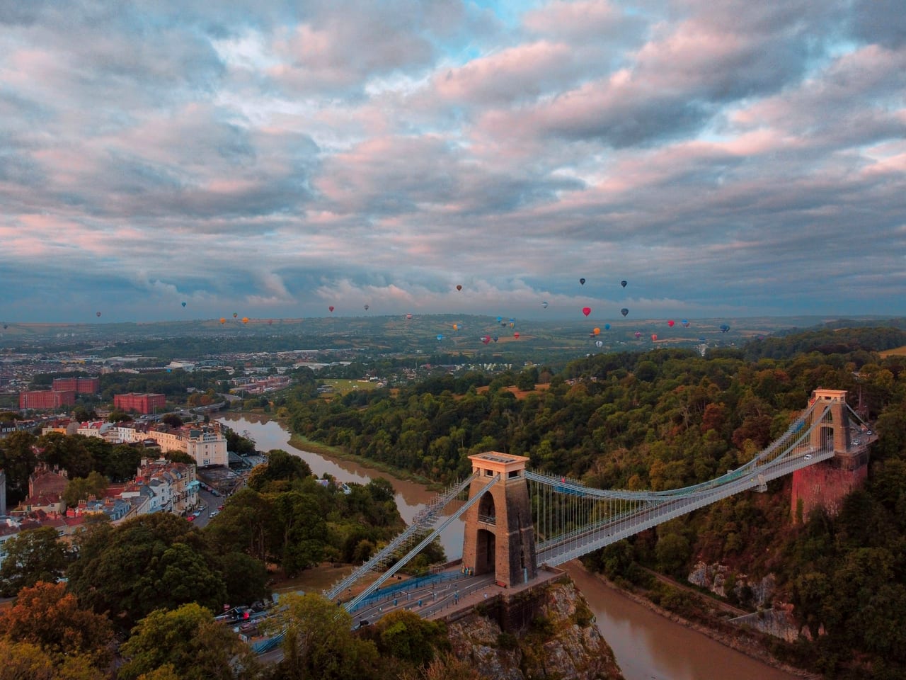 Hot-air balloons drifting over the Clifton Suspension Bridge and the Avon Gorge