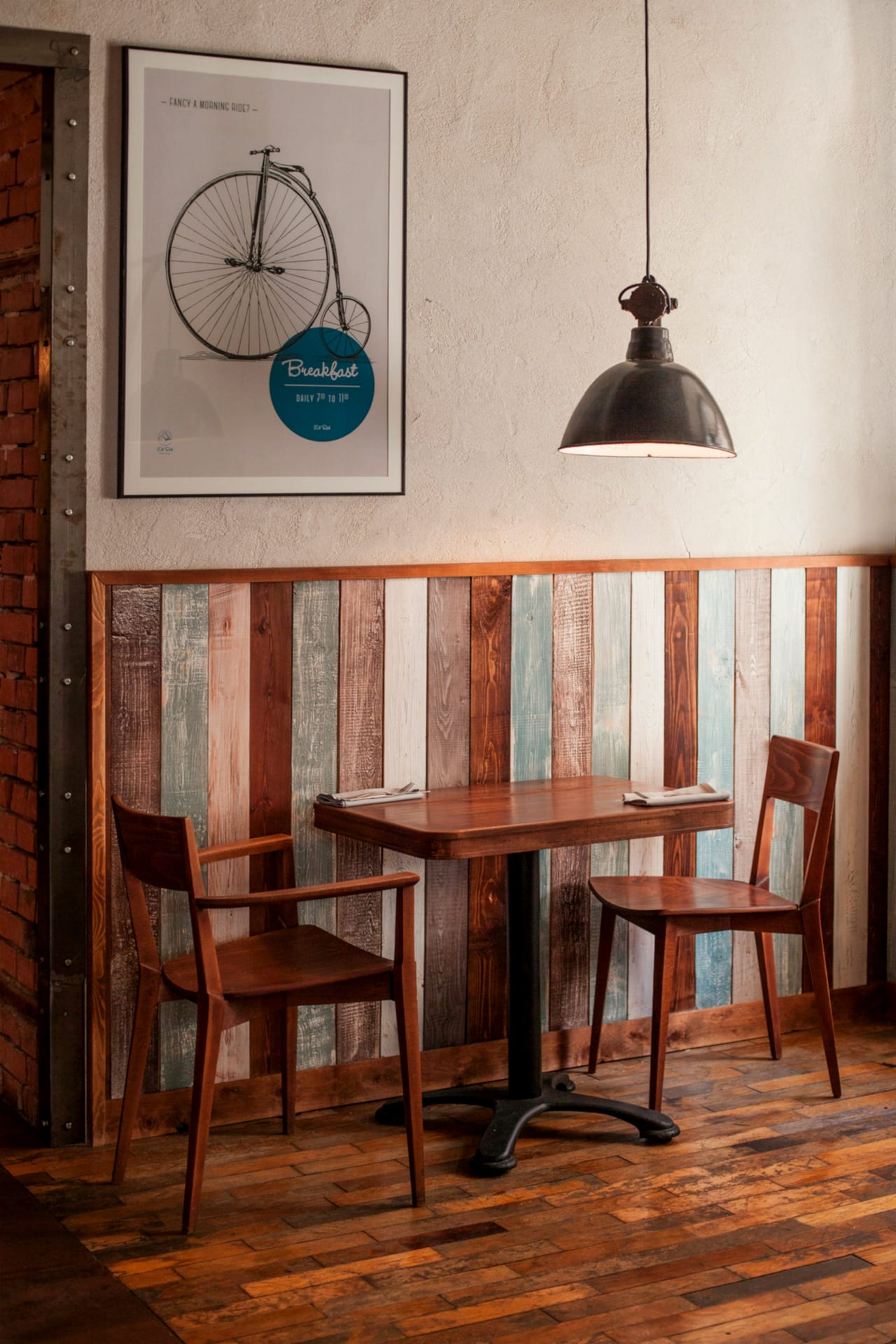 Warm wooden café tables and chairs