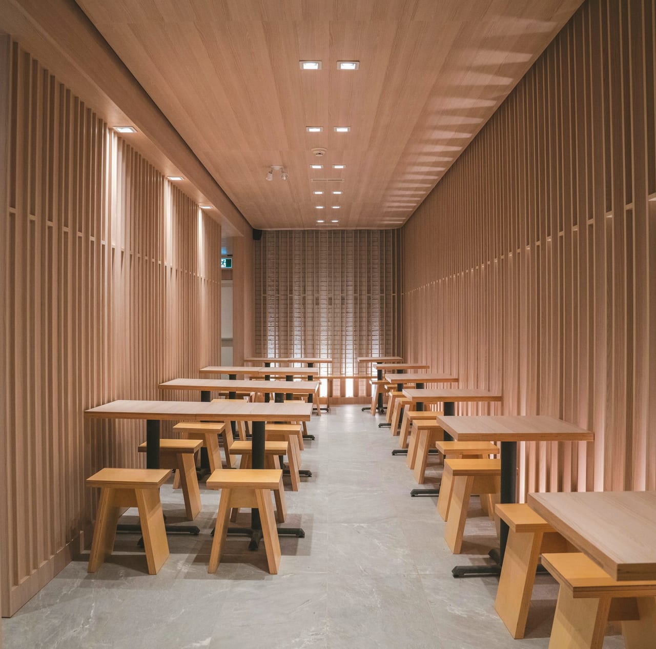 A large room of communal tables, before service