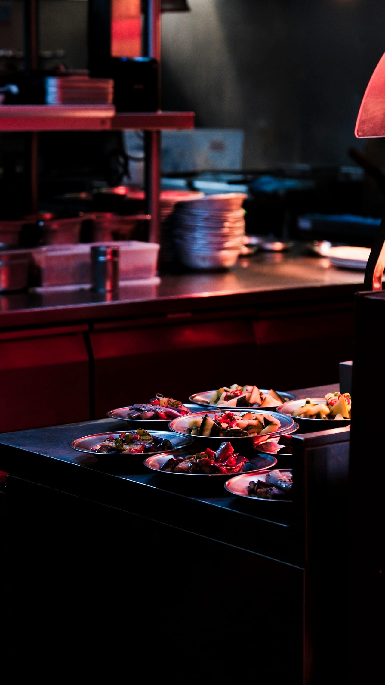 Plates of food ready on the kitchen pass