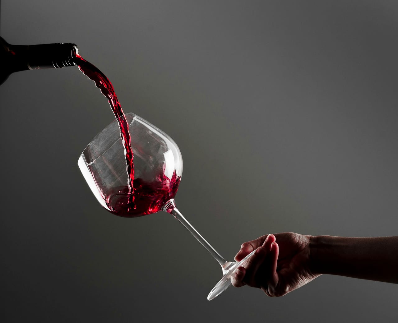 Red wine being poured into a glass